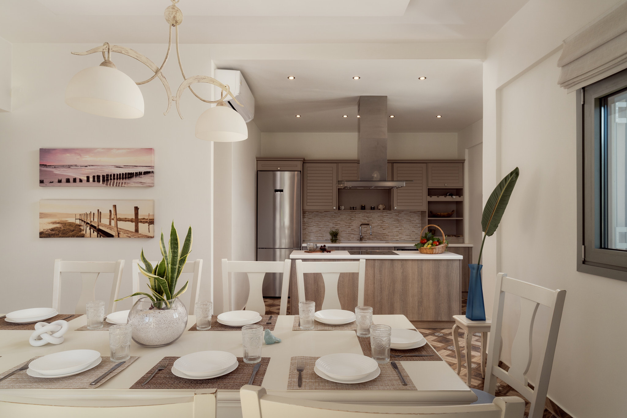 Open-plan dining keeps conversation flowing naturally between kitchen and living spaces. Open-plan dining keeps conversation flowing naturally between kitchen and living spaces.