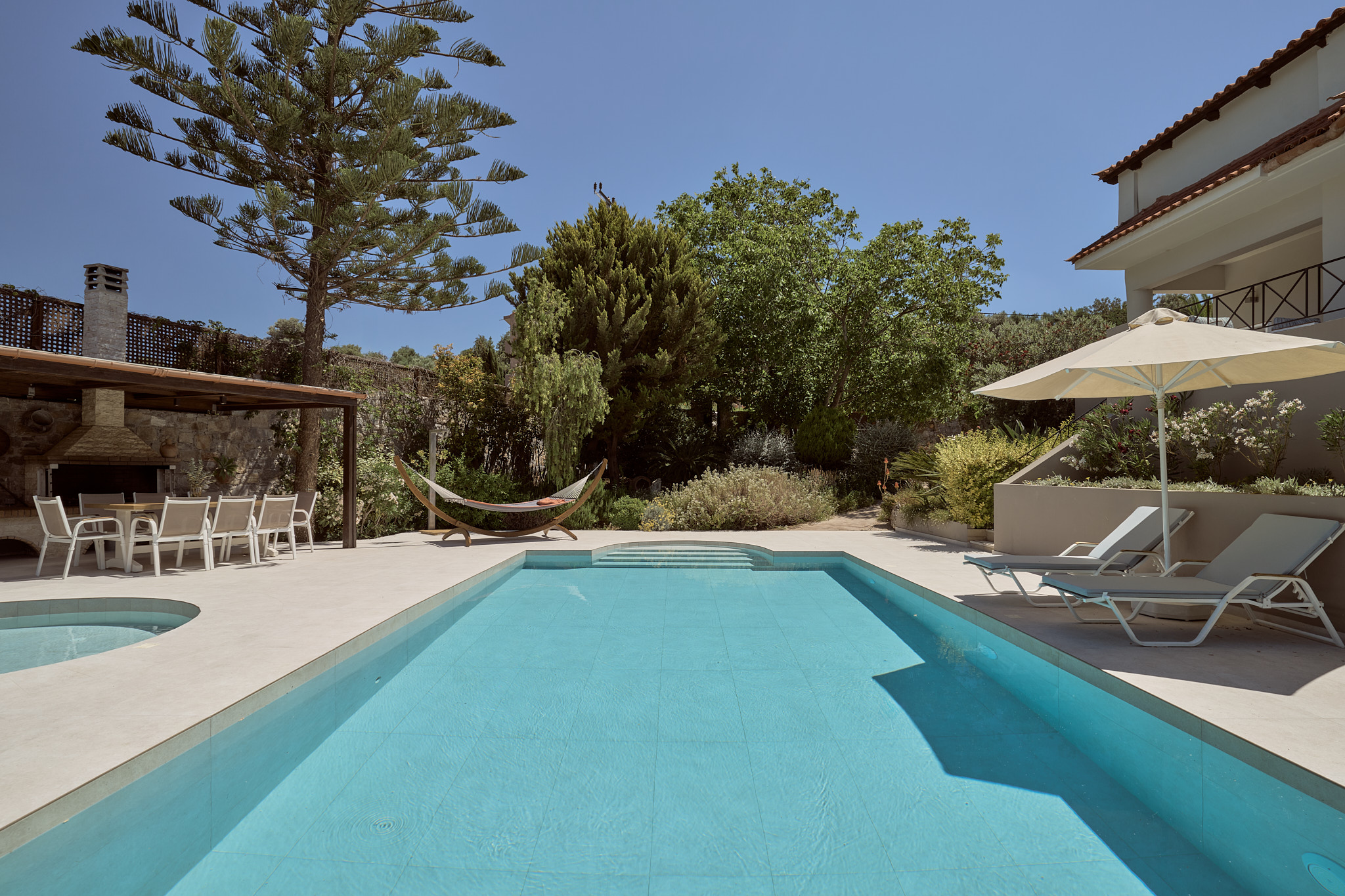 Poolside mornings begin peacefully as sunlight moves across the surrounding gardens. Poolside mornings begin peacefully as sunlight moves across the surrounding gardens.